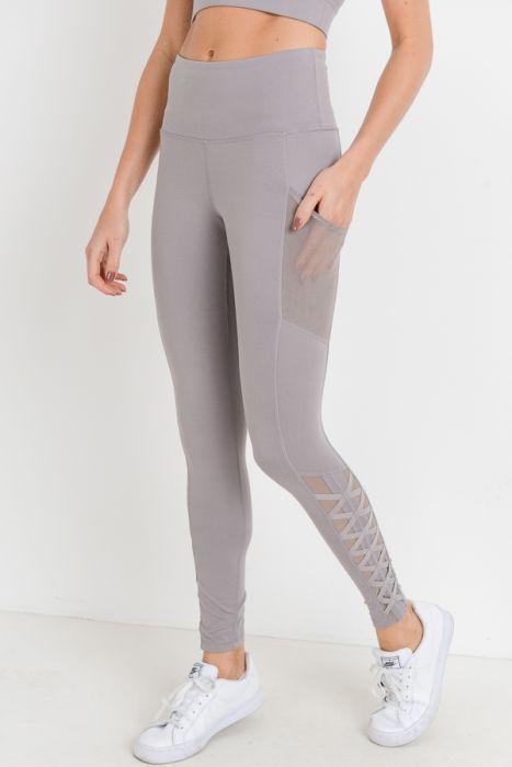 Highwaist Hybrid Mesh & Lattice Straps Full Pocket Leggings featuring stylish mesh panels and convenient side pockets.