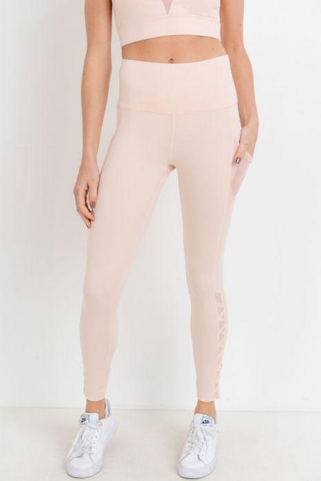 Highwaist Hybrid Mesh & Lattice Straps Full Pocket Leggings featuring stylish mesh panels and convenient side pockets.