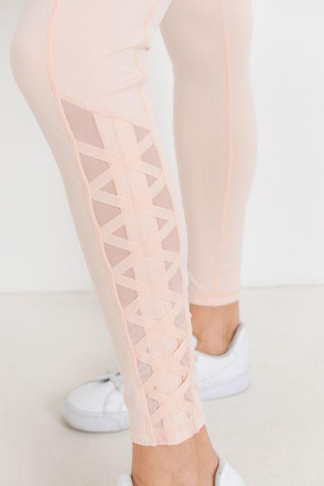 Highwaist Hybrid Mesh & Lattice Straps Full Pocket Leggings featuring stylish mesh panels and convenient side pockets.