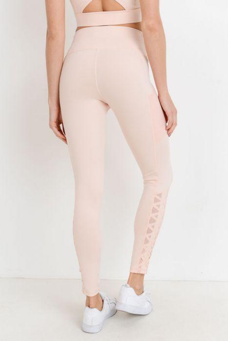 Highwaist Hybrid Mesh & Lattice Straps Full Pocket Leggings featuring stylish mesh panels and convenient side pockets.