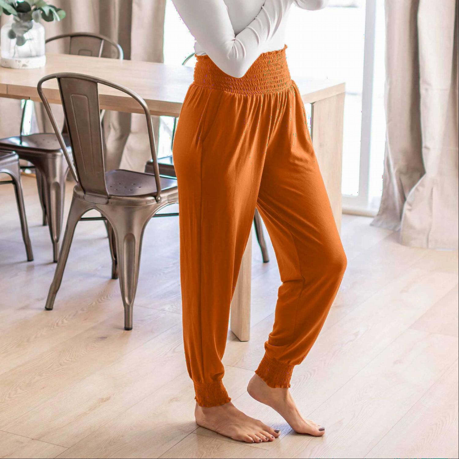 High-waisted Smocked Lounge Jogger Pants in various colors, featuring an elasticated waist and fitted ankles, perfect for lounging or casual wear.