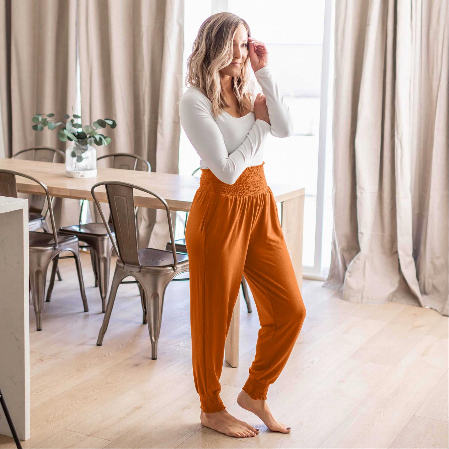 High-waisted Smocked Lounge Jogger Pants in various colors, featuring an elasticated waist and fitted ankles, perfect for lounging or casual wear.