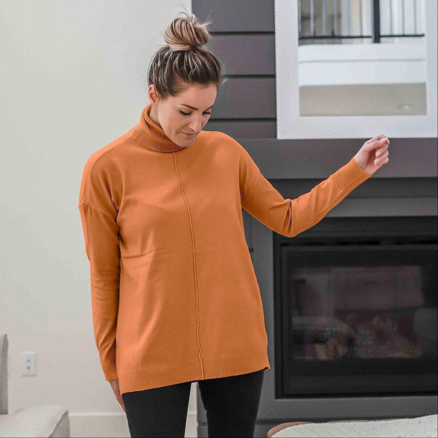 A stylish Hi-low Garment Dyed Turtleneck Sweater featuring a ribbed waistline and wrist cuffs, available in various colors.