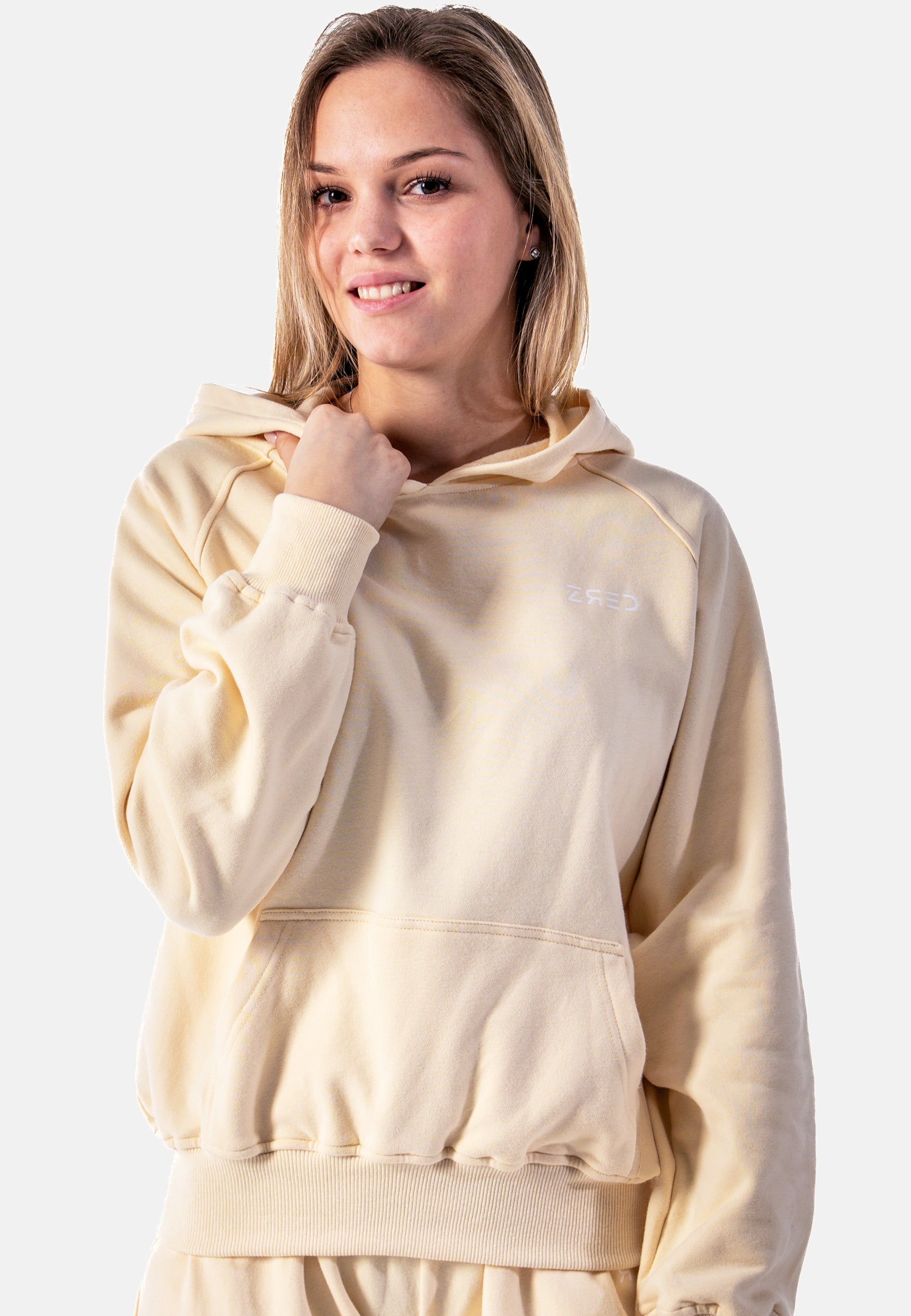 Stylish yellow women's hoodie with a cozy lined pocket and loose fit, perfect for casual wear and relaxation.