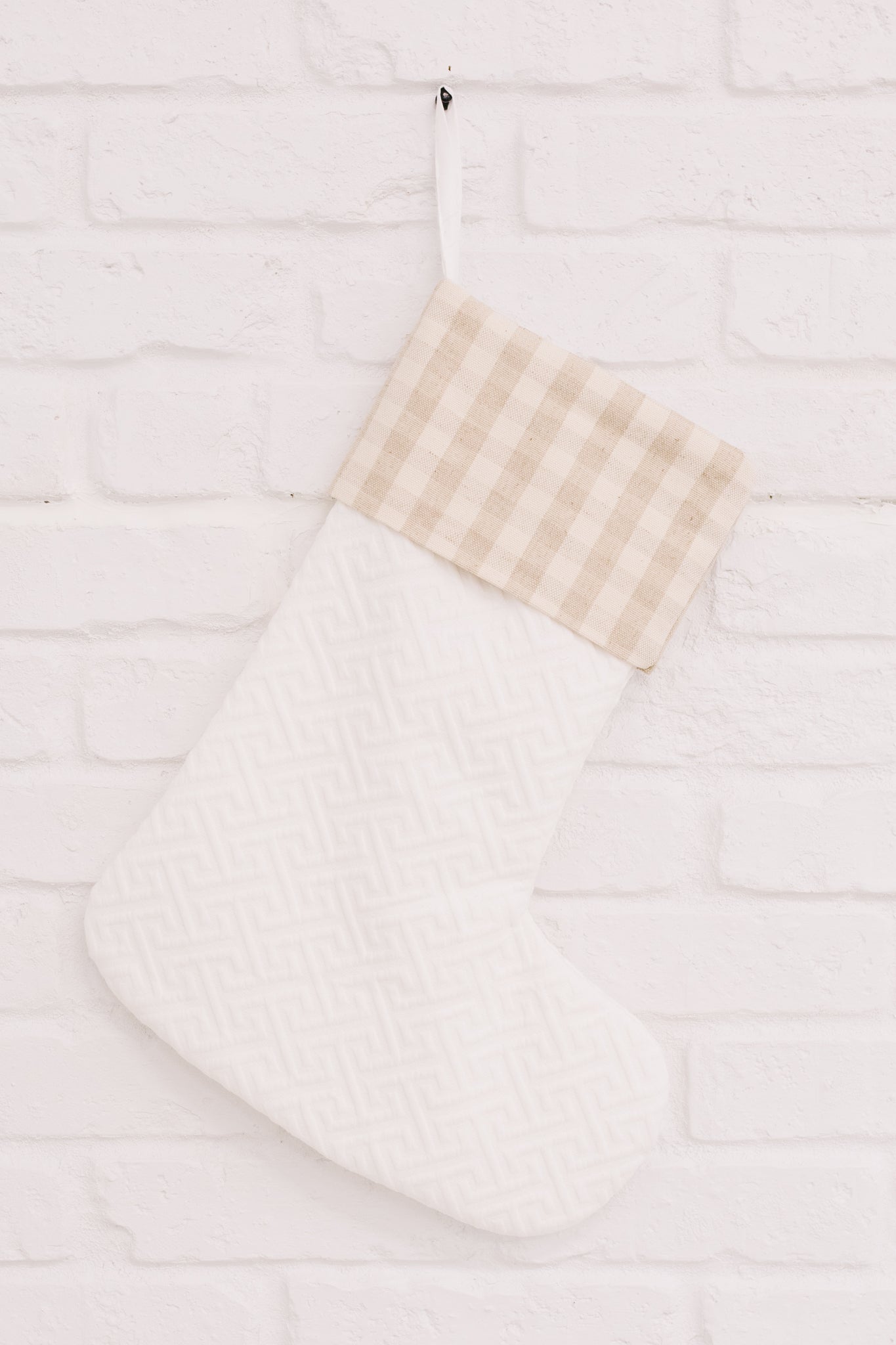 Neutral colored Holiday Chic Stocking with a hanging loop, perfect for festive decor.