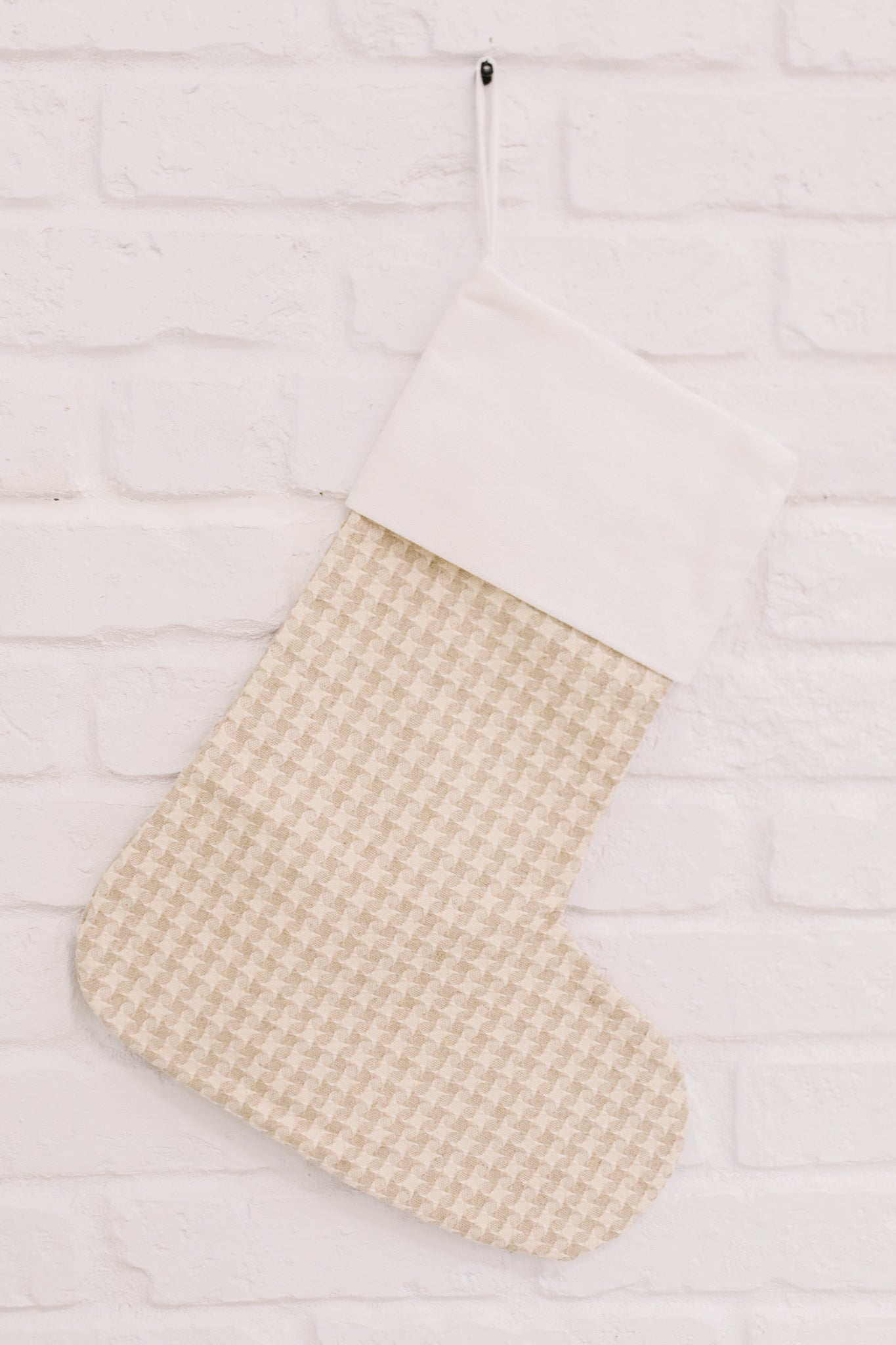 Neutral colored Holiday Chic Stocking with a hanging loop, perfect for festive decor.