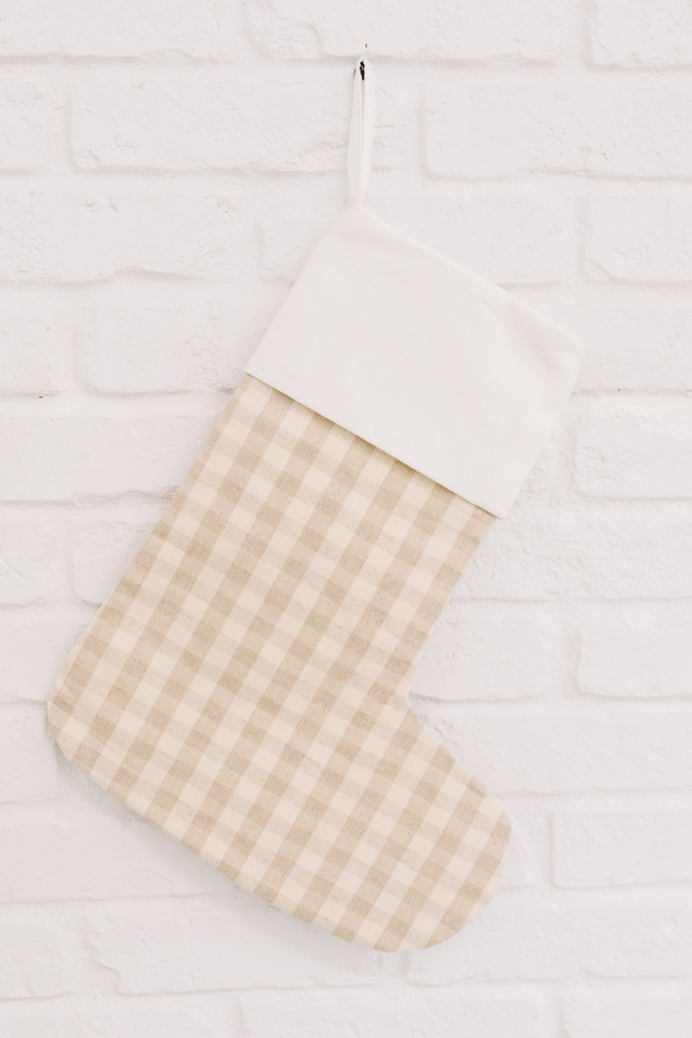 Neutral colored Holiday Chic Stocking with a hanging loop, perfect for festive decor.