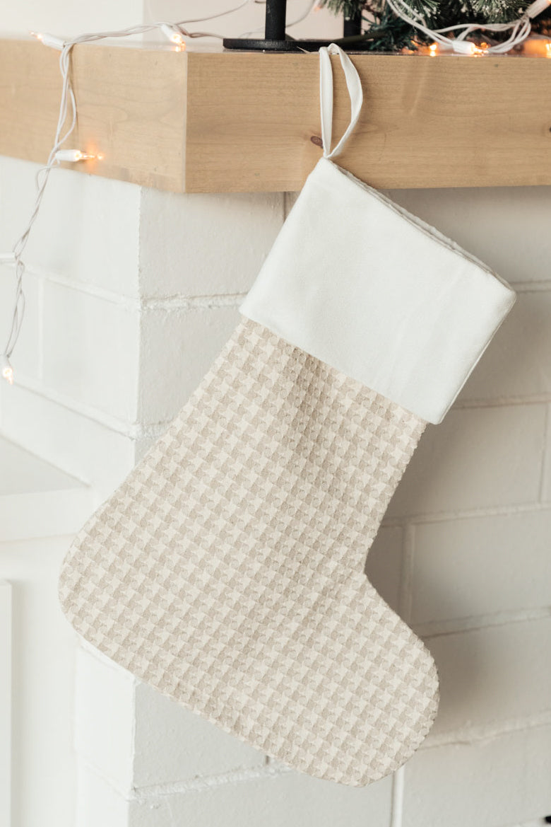 Neutral colored Holiday Chic Stocking with a hanging loop, perfect for festive decor.