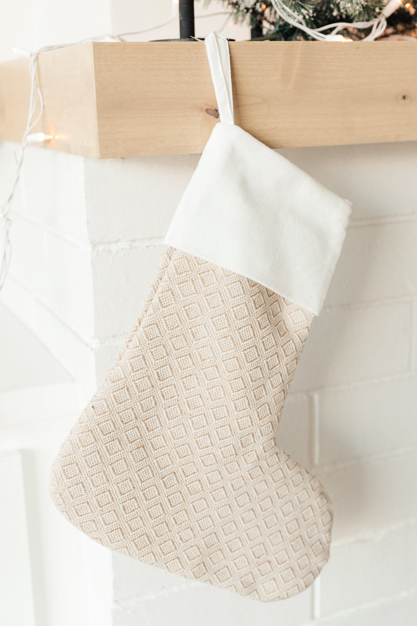 Neutral colored Holiday Chic Stocking with a hanging loop, perfect for festive decor.