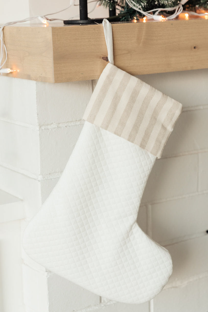 Neutral colored Holiday Chic Stocking with a hanging loop, perfect for festive decor.