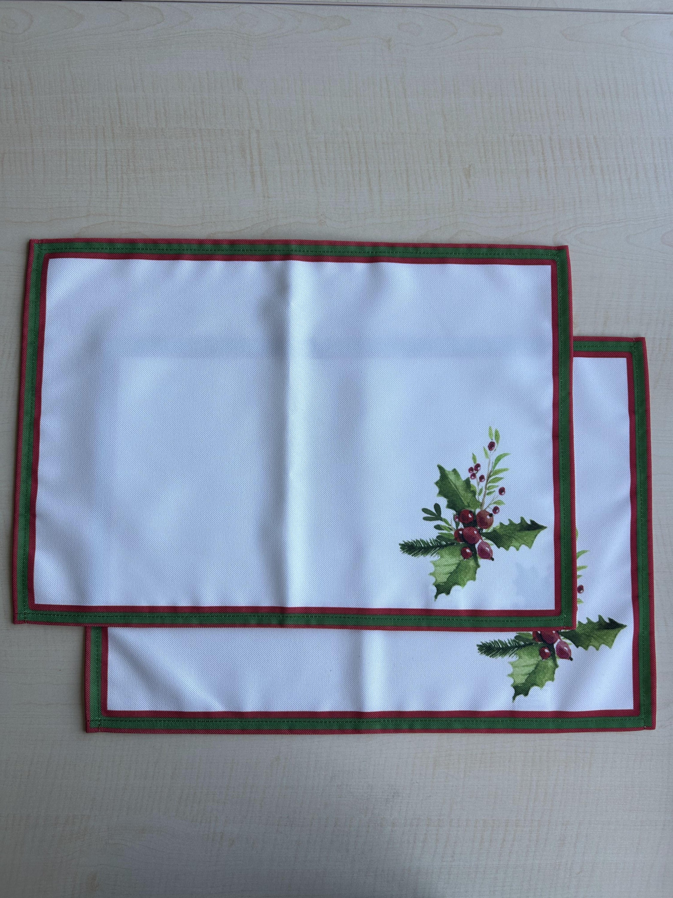 Holly Berry and Greenery Pattern Placemats on an ivory background, featuring a festive holiday design with traditional colors.