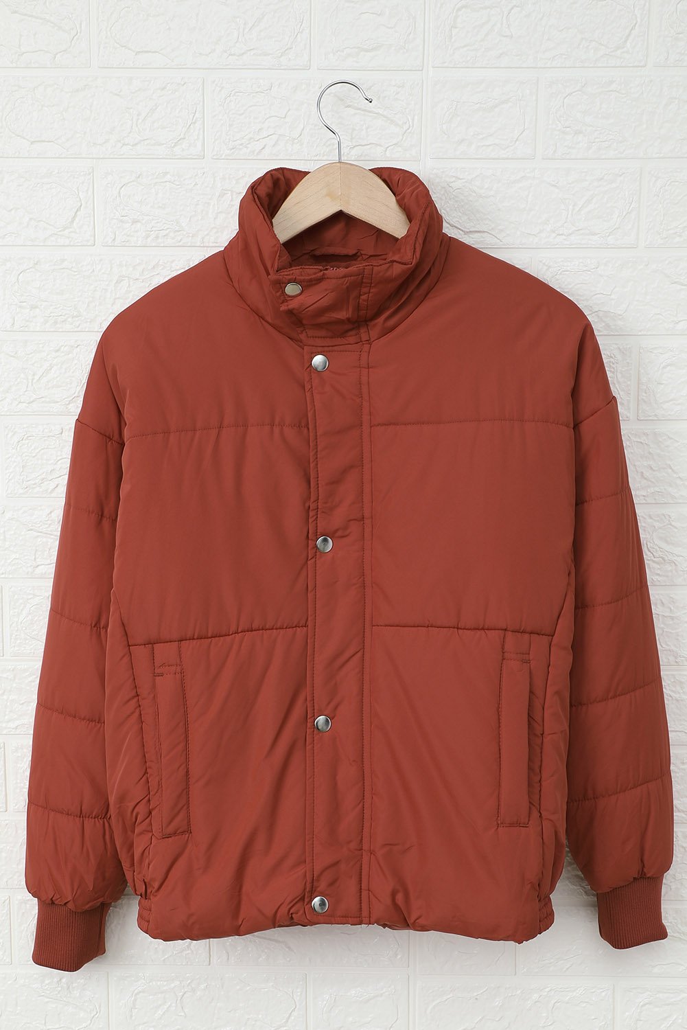 Holly Pocketed Puffer Jacket in stylish design with deep pockets, showcasing its soft fabric and dual closure.