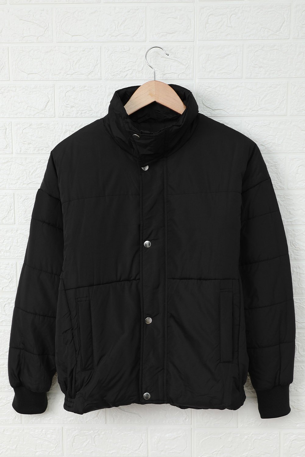 Holly Pocketed Puffer Jacket in stylish design with deep pockets, showcasing its soft fabric and dual closure.