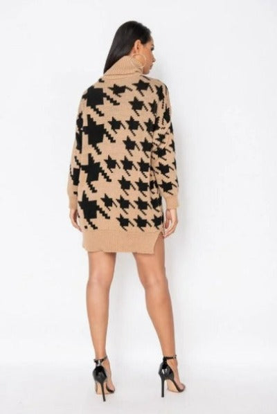 A stylish Houndstooth Check Roll Neck Jumper Dress displayed on a mannequin, featuring a cozy roll neck and a chic houndstooth pattern.