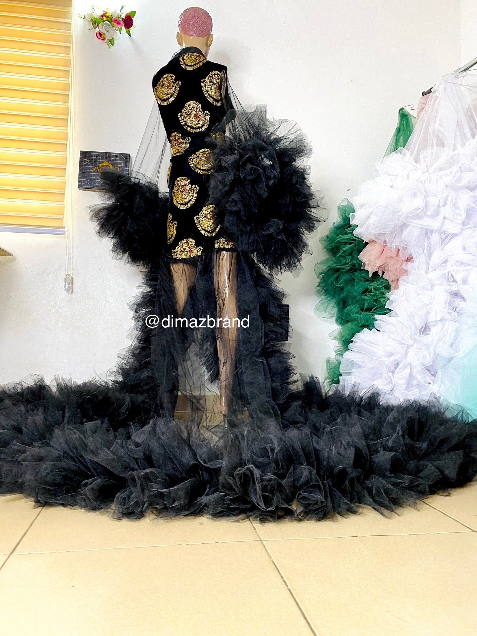 An elegant Igbo bride isiagu tulle wedding robe featuring traditional isiagu fabric and delicate tulle, perfect for modern weddings.