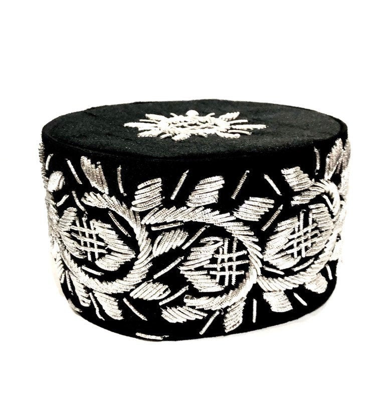 A stylish Igbo cap featuring intricate embroidery-like beading, available in various colors.