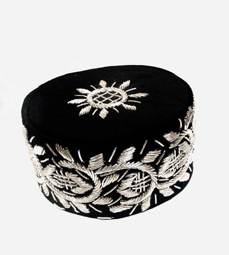 A stylish Igbo cap featuring intricate embroidery-like beading, available in various colors.