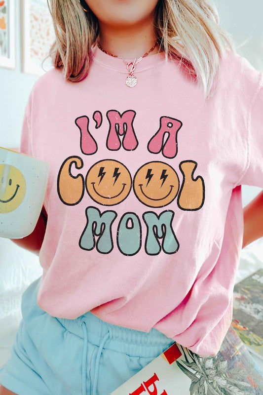 I'M A COOL MOM HAPPY FACE GRAPHIC TEE featuring a cheerful happy face design, made from 100% cotton, available in various sizes.