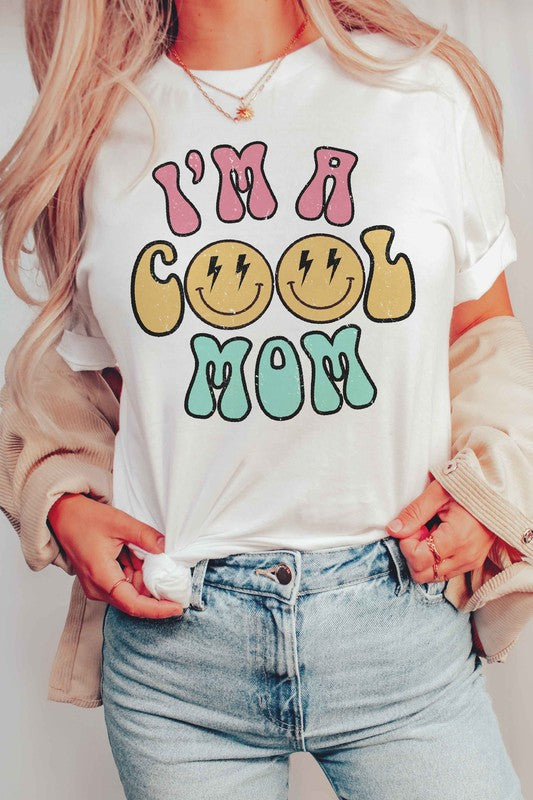 I'M A COOL MOM HAPPY FACE GRAPHIC TEE featuring a cheerful happy face design, made from 100% cotton, available in various sizes.