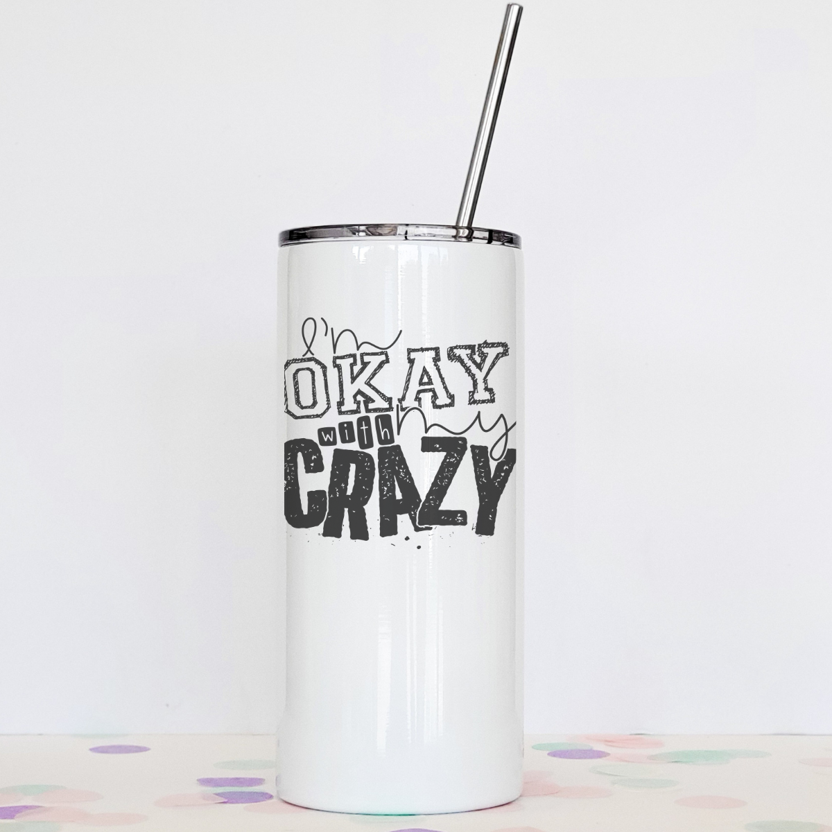 I'm Okay With My Crazy Tumbler featuring a clear slider lid and stainless steel straw, designed for hot and cold beverages.