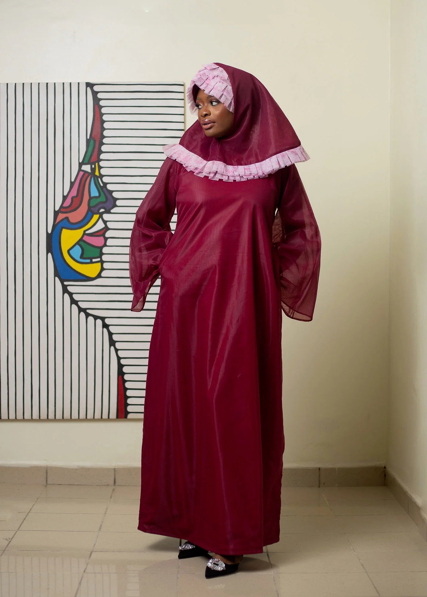 Iman Dress featuring luxurious wine tulle fabric with long sleeves and ruffles, accompanied by a matching hijab.