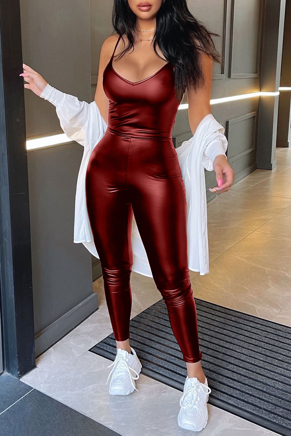 Burgundy imitation leather fashion jumpsuit Tuvala with sleeveless design and deep round neckline, featuring a back zipper.