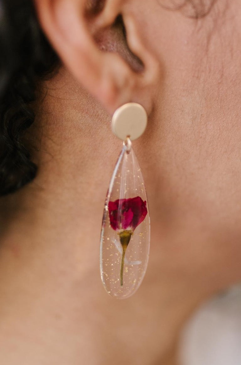 A pair of Impressively Pressed Earrings in Cardinal featuring unique floral designs encased in translucent tear drop shapes.