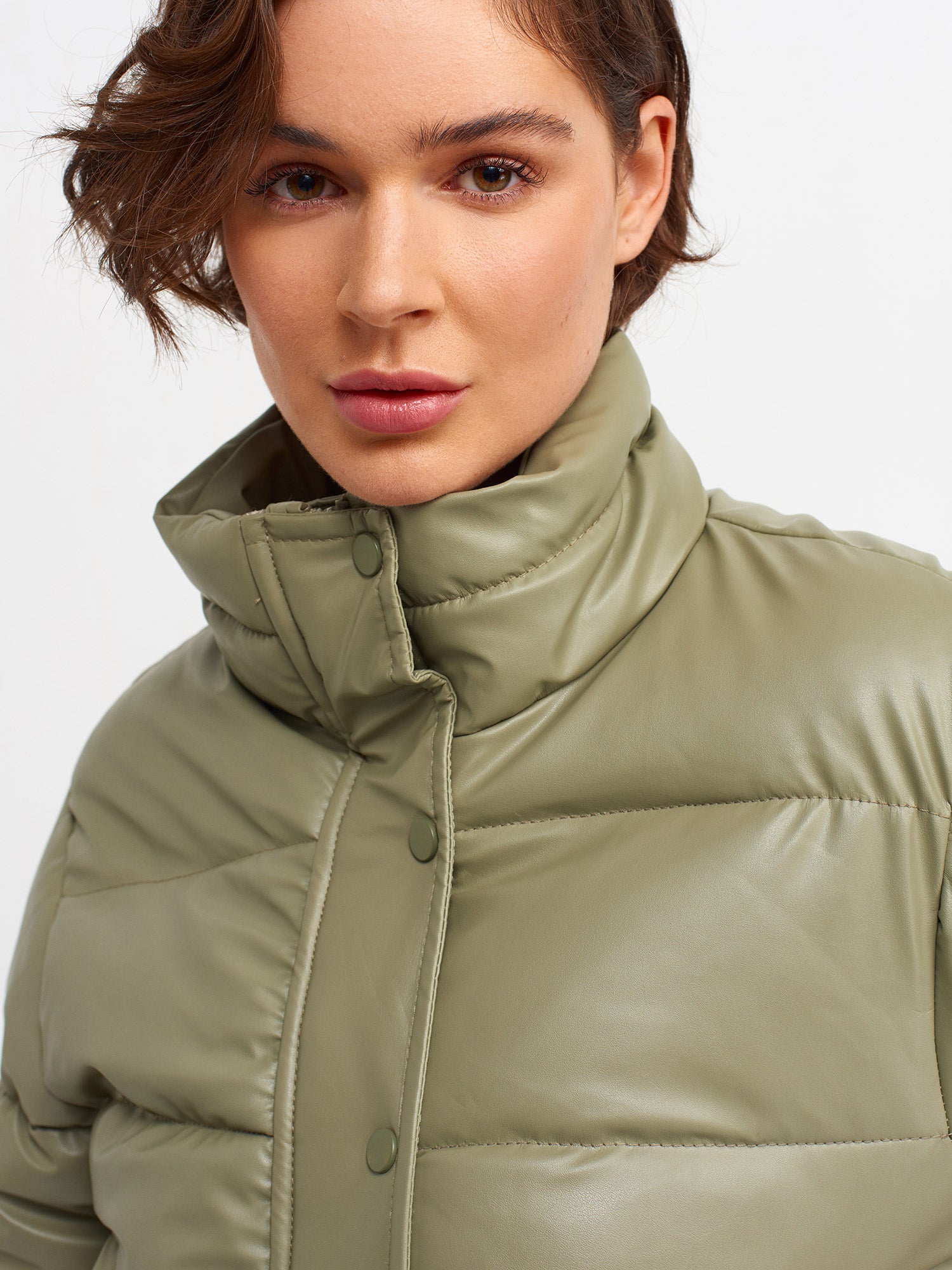 A stylish inflatable coat made from polyester and polyurethane, showcasing its lightweight and water-resistant features.