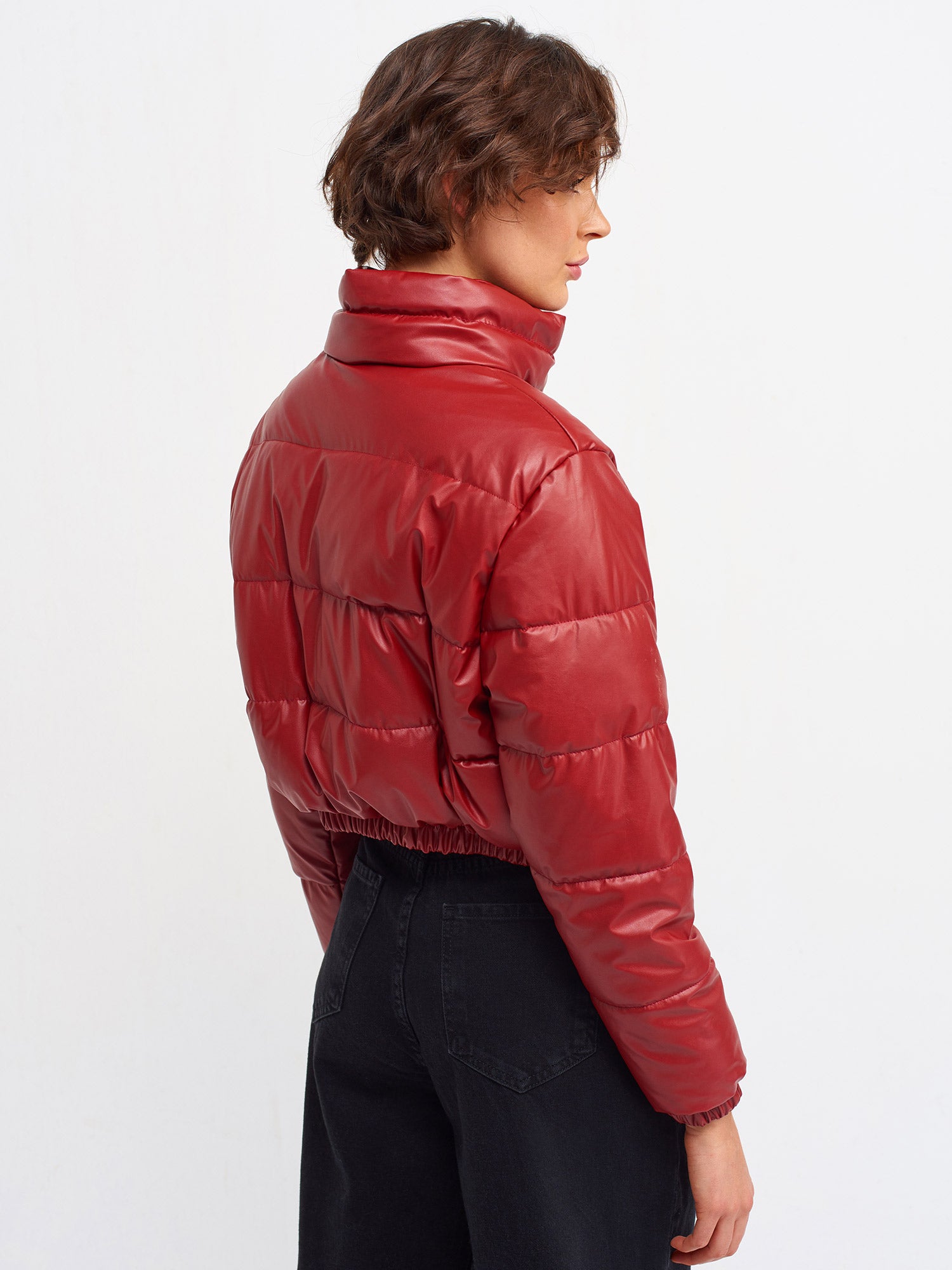 A stylish inflatable coat made from polyester and polyurethane, showcasing its lightweight and water-resistant features.