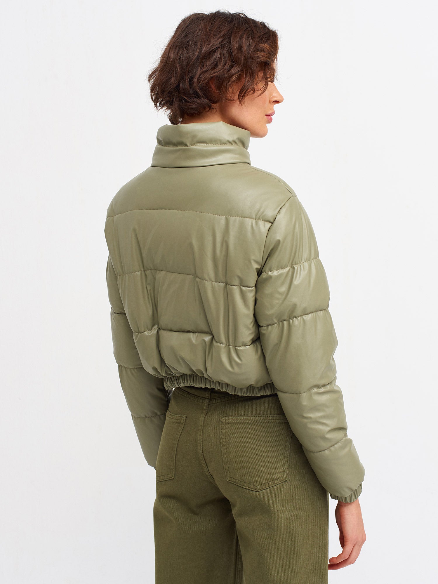 A stylish inflatable coat made from polyester and polyurethane, showcasing its lightweight and water-resistant features.