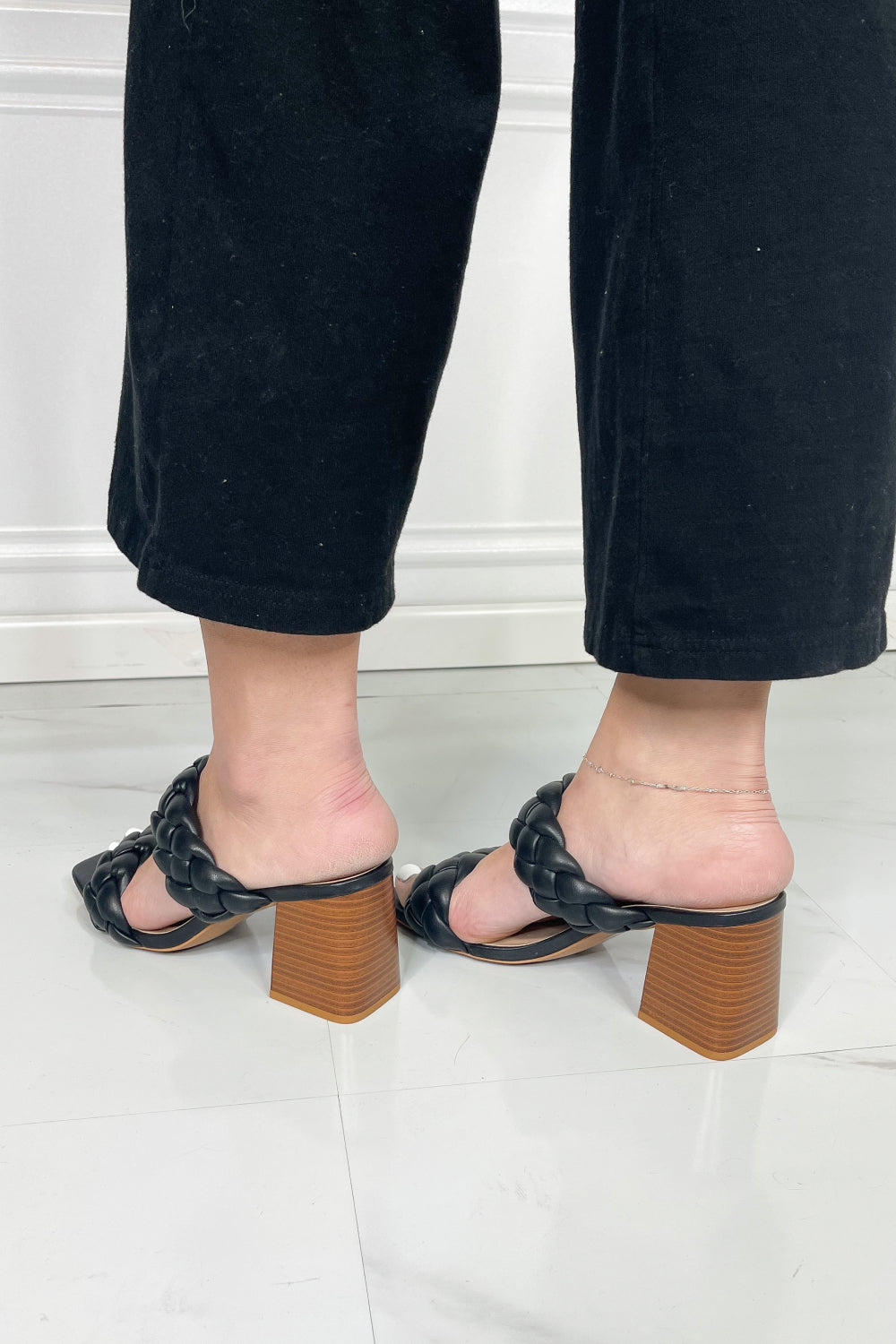 Interwoven Ideas Braided Strap Block Heel Slide Sandal in Black featuring a chic braided double-strap design and a comfortable open toe.