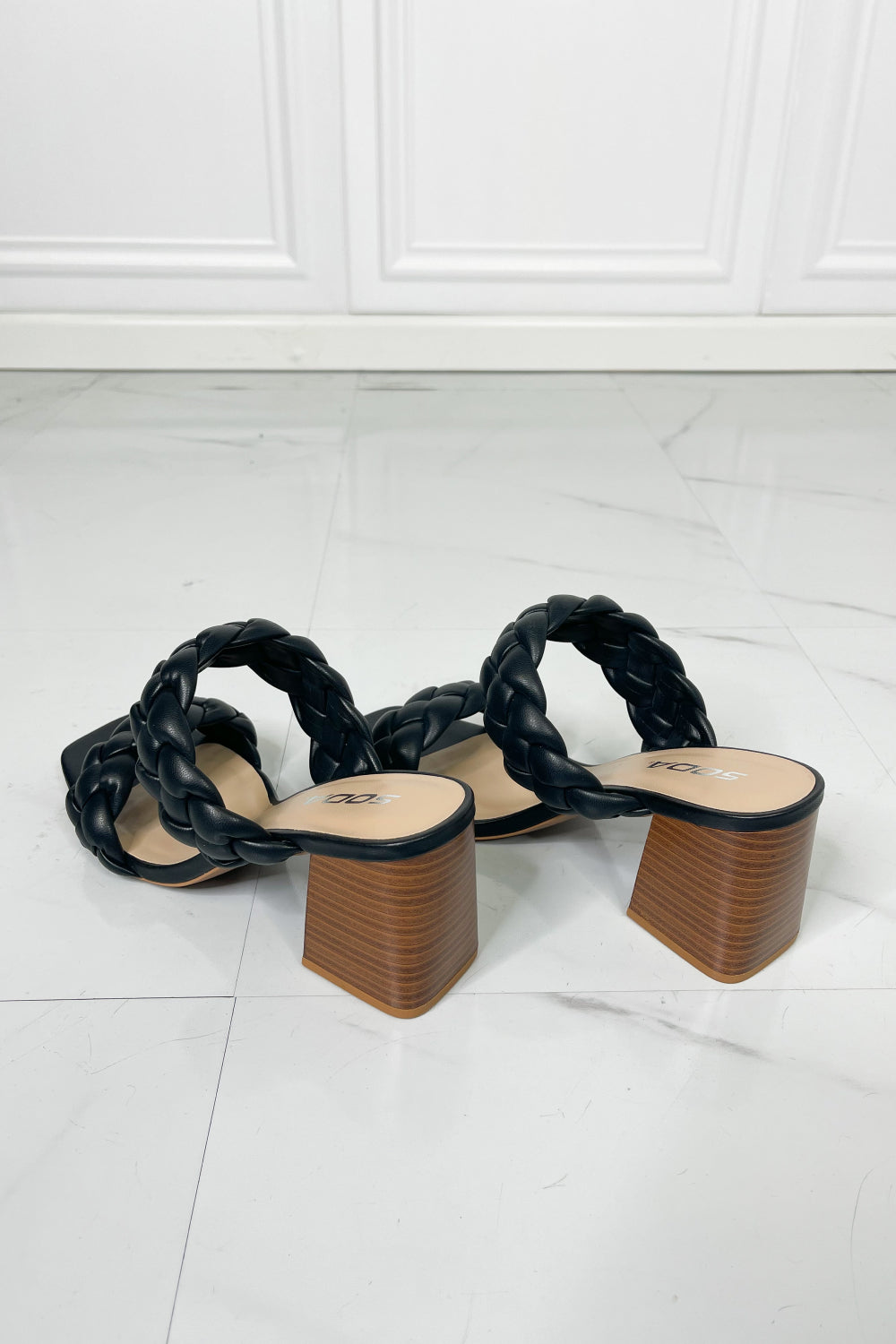 Interwoven Ideas Braided Strap Block Heel Slide Sandal in Black featuring a chic braided double-strap design and a comfortable open toe.