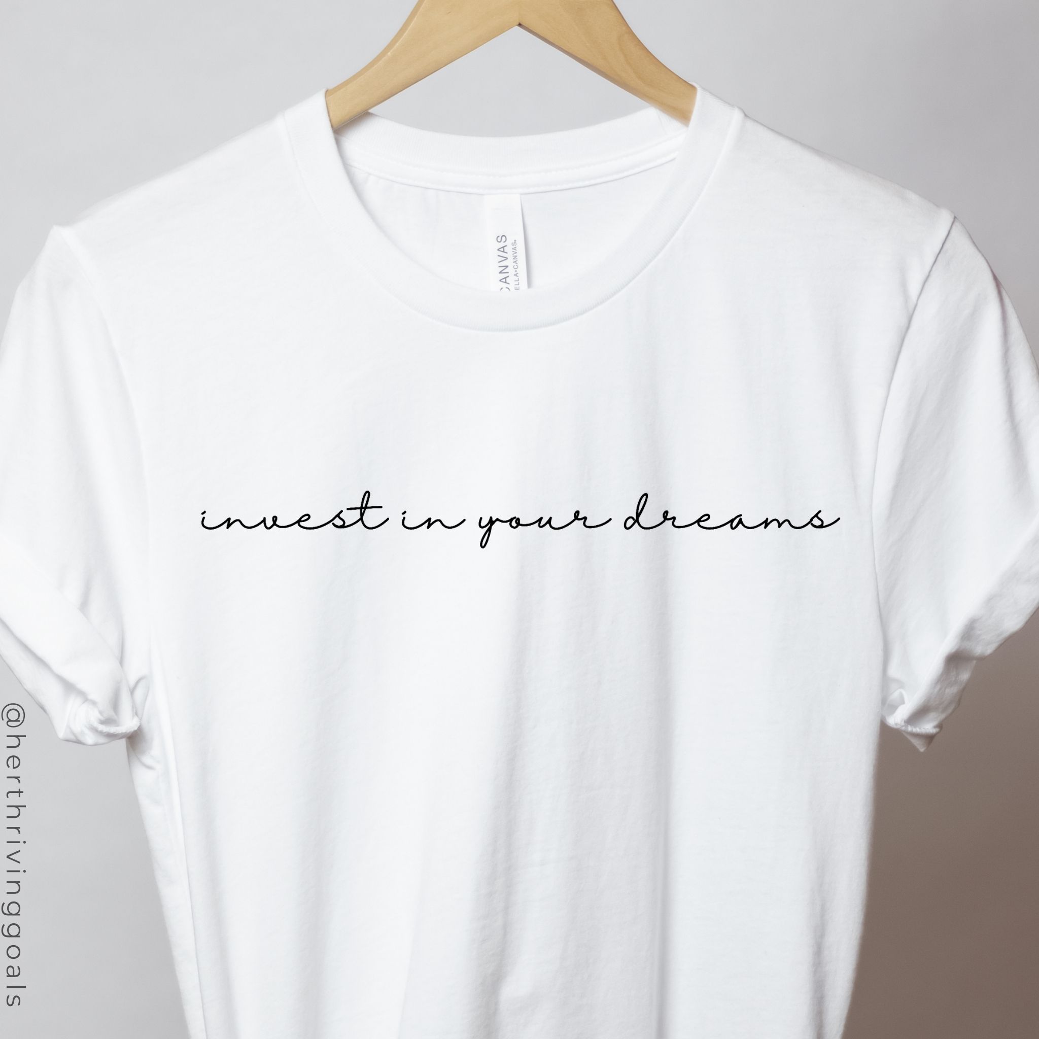 A stylish black t-shirt with the phrase 'Invest in Your Dreams' printed in bold letters, symbolizing motivation for entrepreneurs.