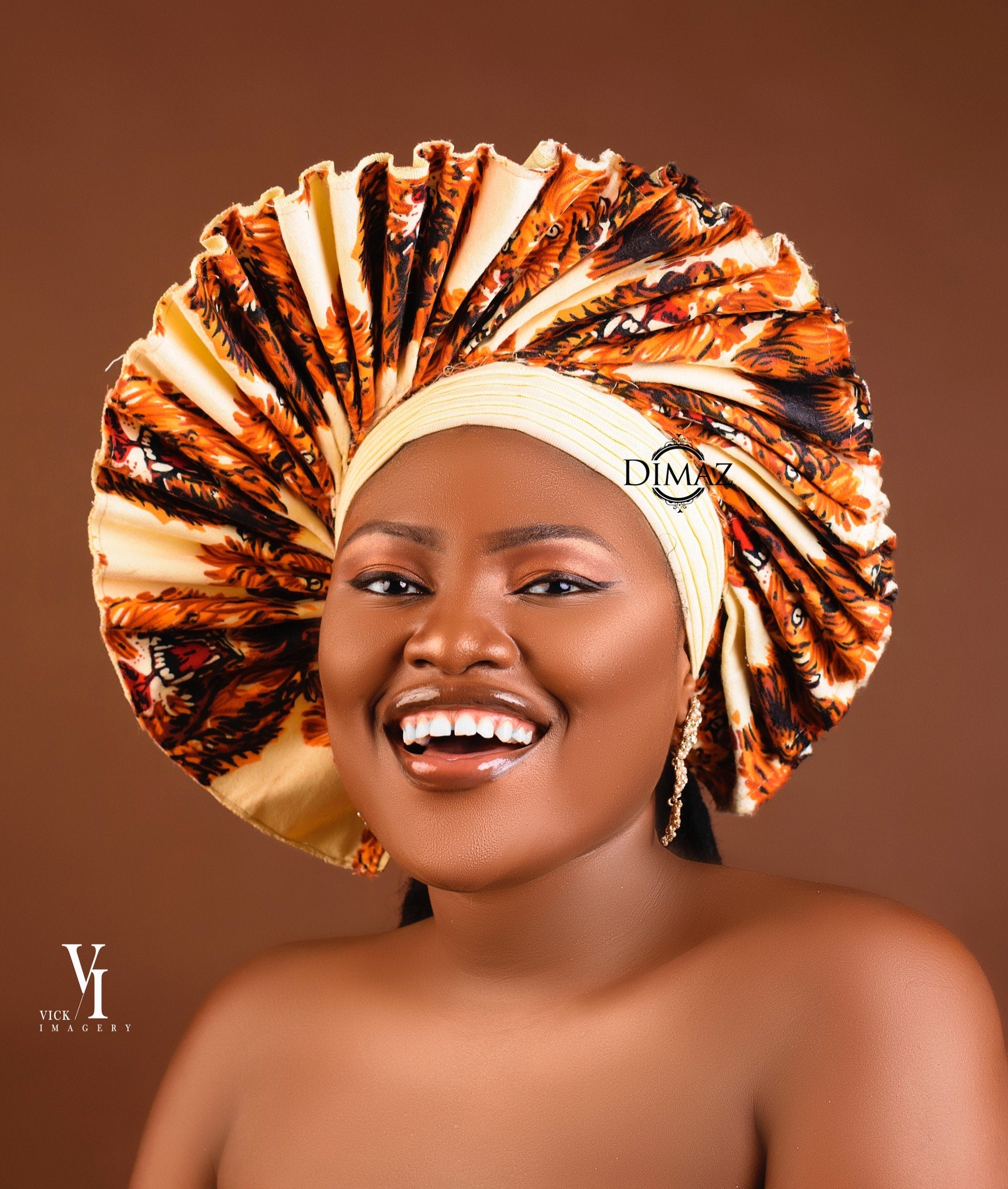 Handmade Isiagu Head Wrap in vibrant fabric, elegantly displayed in a luxury box, showcasing its cultural significance.