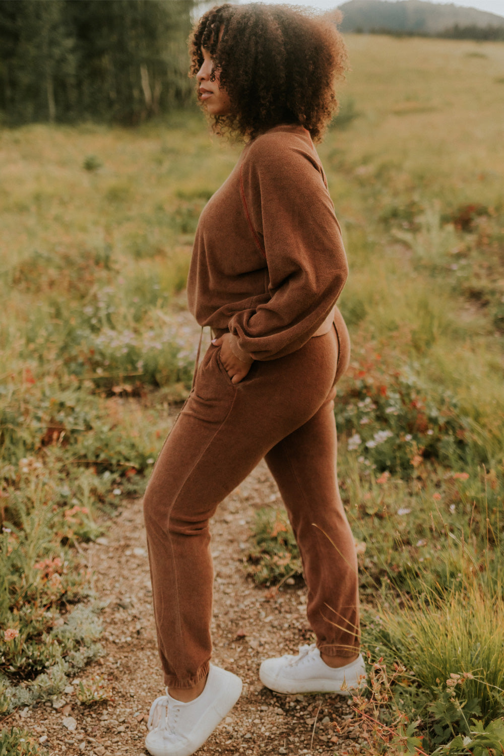 A pair of stylish It’s All Good Joggers in orange, featuring a drawstring waist, pockets, and elastic hem, showcasing a modern front seam design.