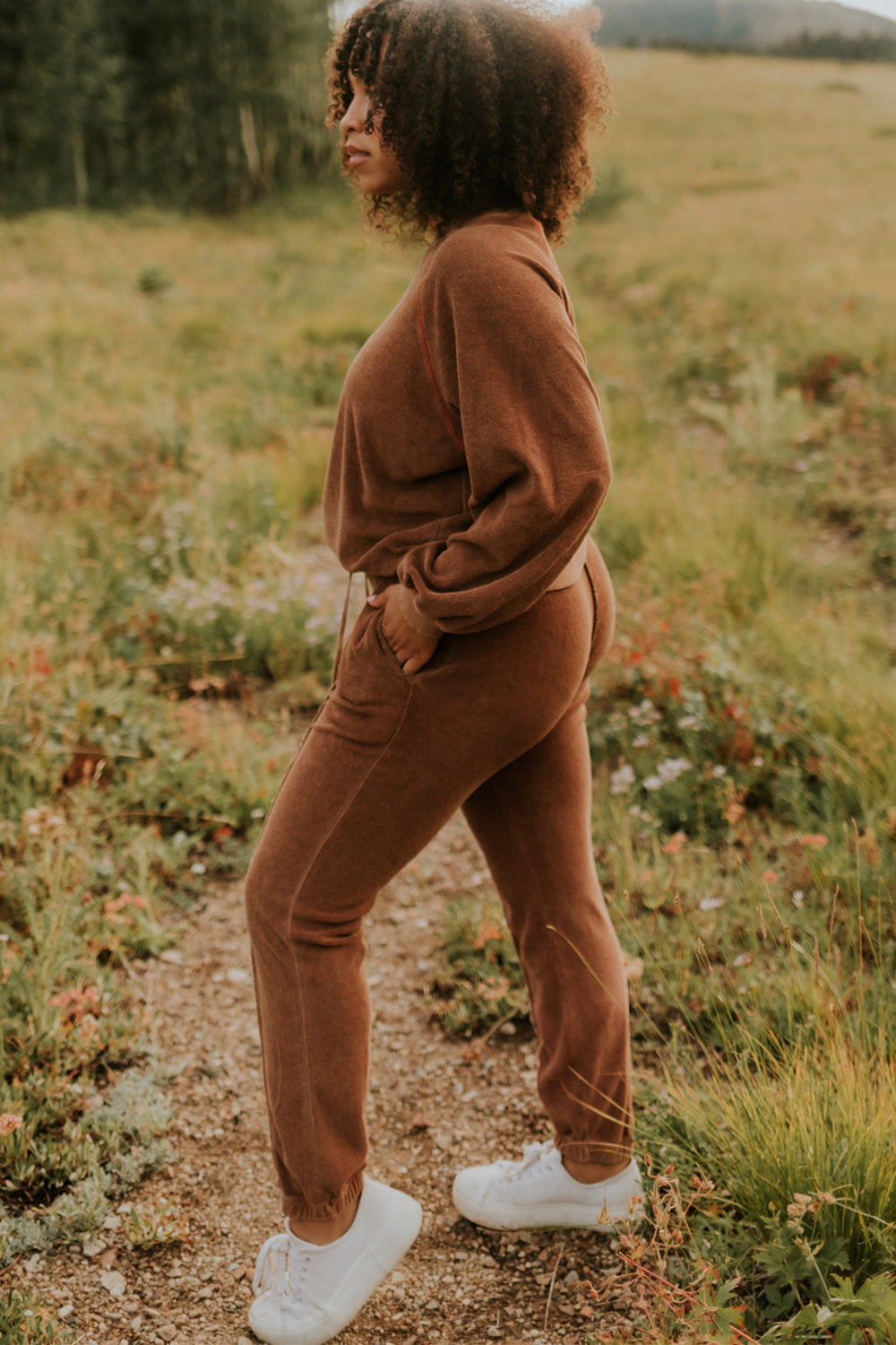 A pair of stylish It’s All Good Joggers in orange, featuring a drawstring waist, pockets, and elastic hem, showcasing a modern front seam design.