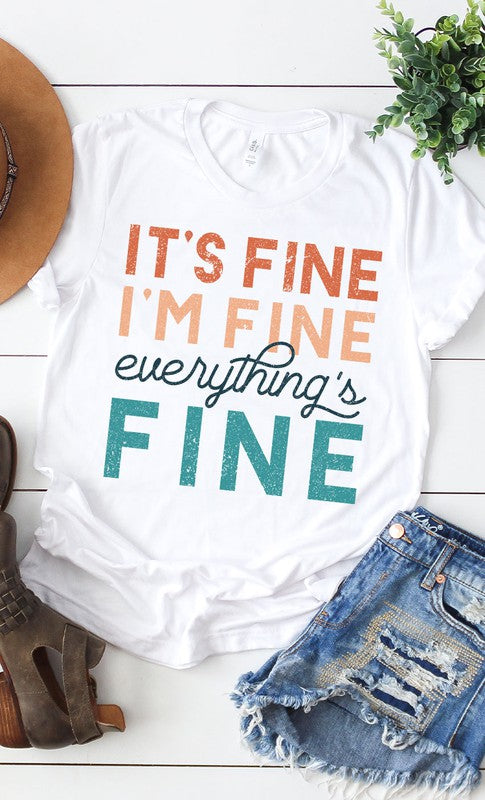 A stylish white graphic tee featuring the text 'It's Fine I'm Fine Everything's Fine' in a playful font, made from soft cotton material.