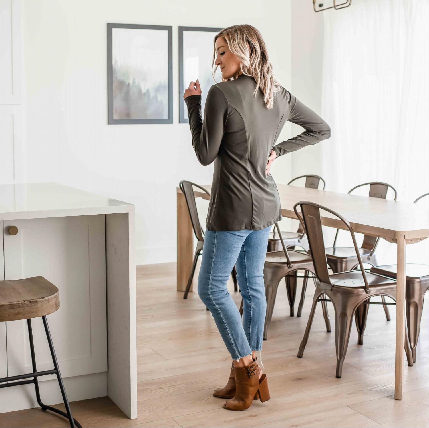 Ity Long Sleeve Mock Neck Top in black, featuring a fitted design and modest half-turtleneck collar.