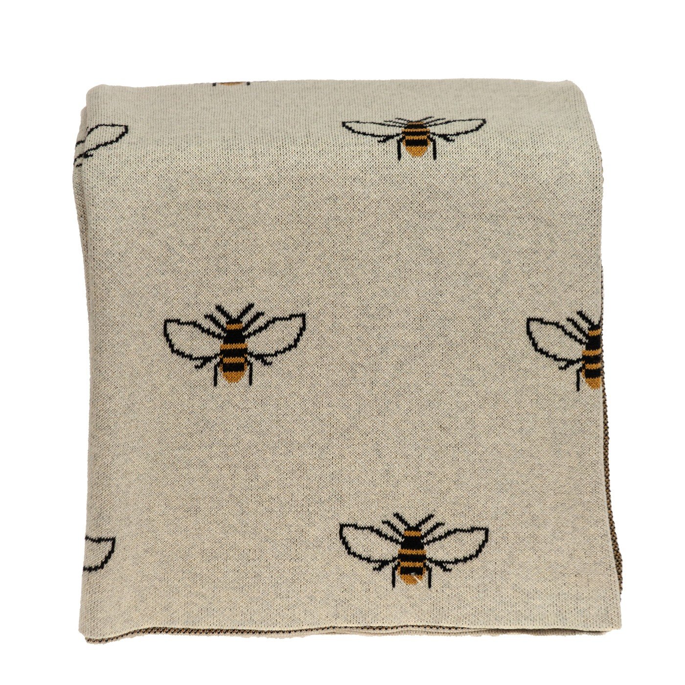 Ivory Bumble Bee Knitted Throw Blanket draped elegantly over a sofa, showcasing its unique bumble bee design and soft texture.