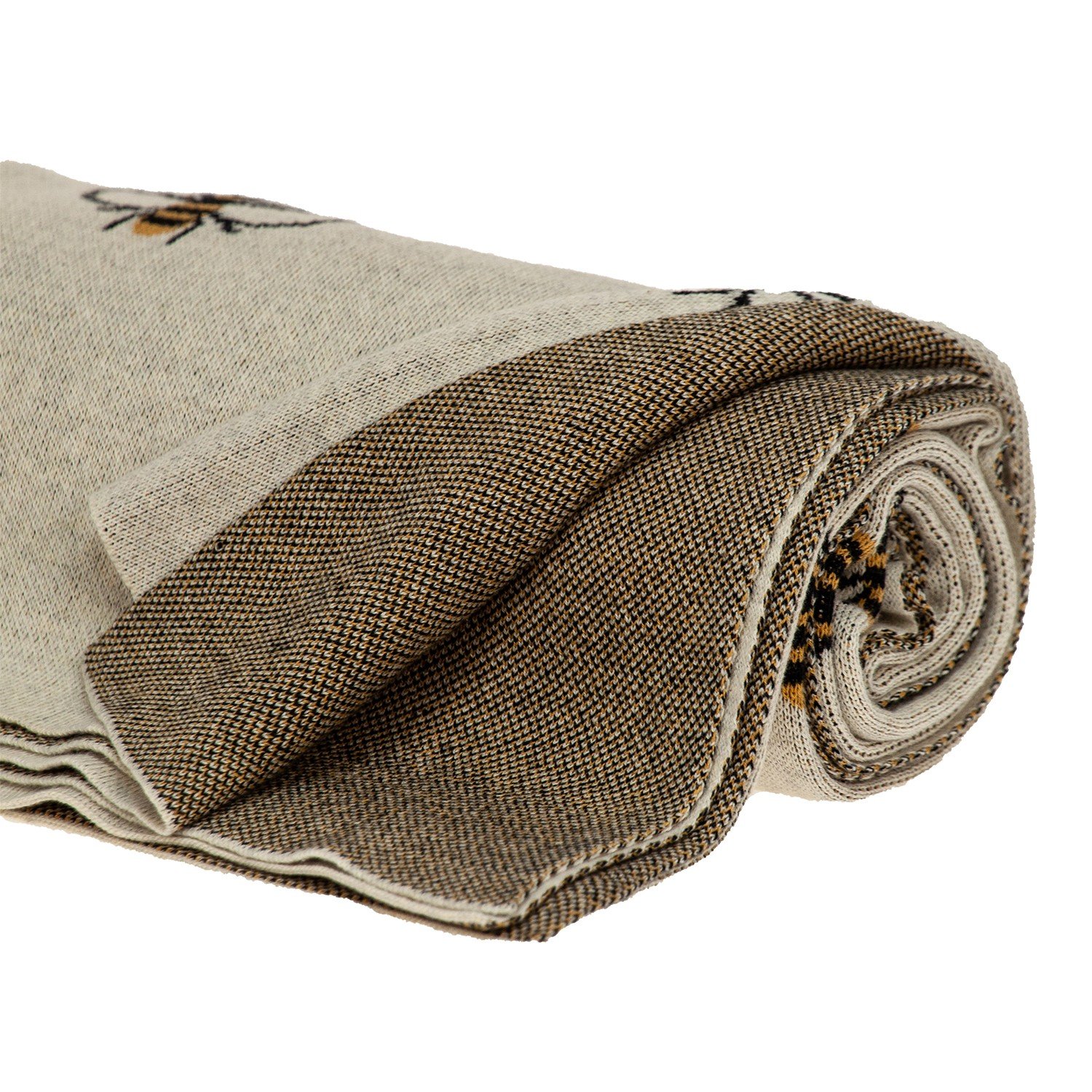 Ivory Bumble Bee Knitted Throw Blanket draped elegantly over a sofa, showcasing its unique bumble bee design and soft texture.