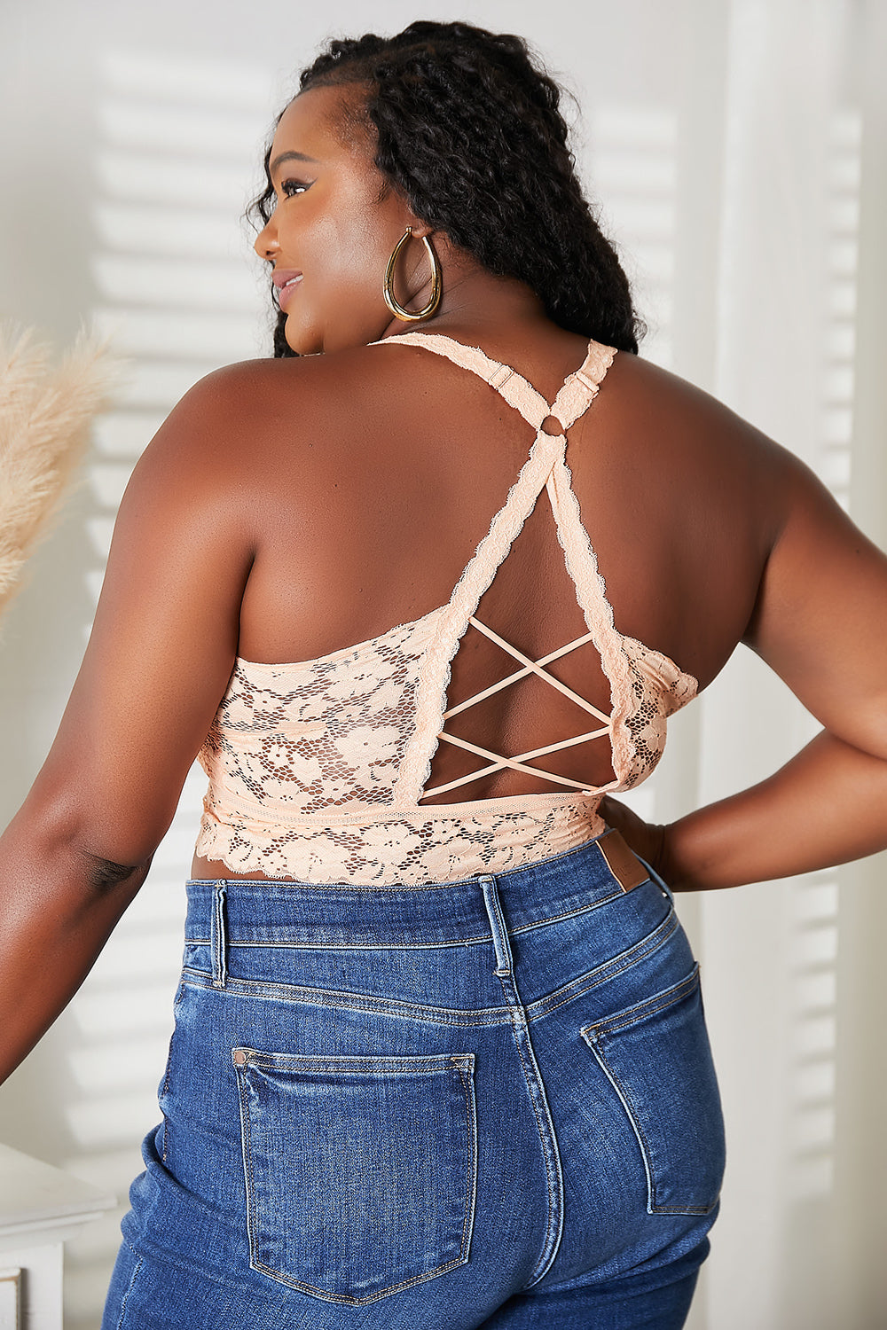 JadyK Full Size Crisscross Lace Bralette featuring intricate lace detailing and removable padding, perfect for layering.