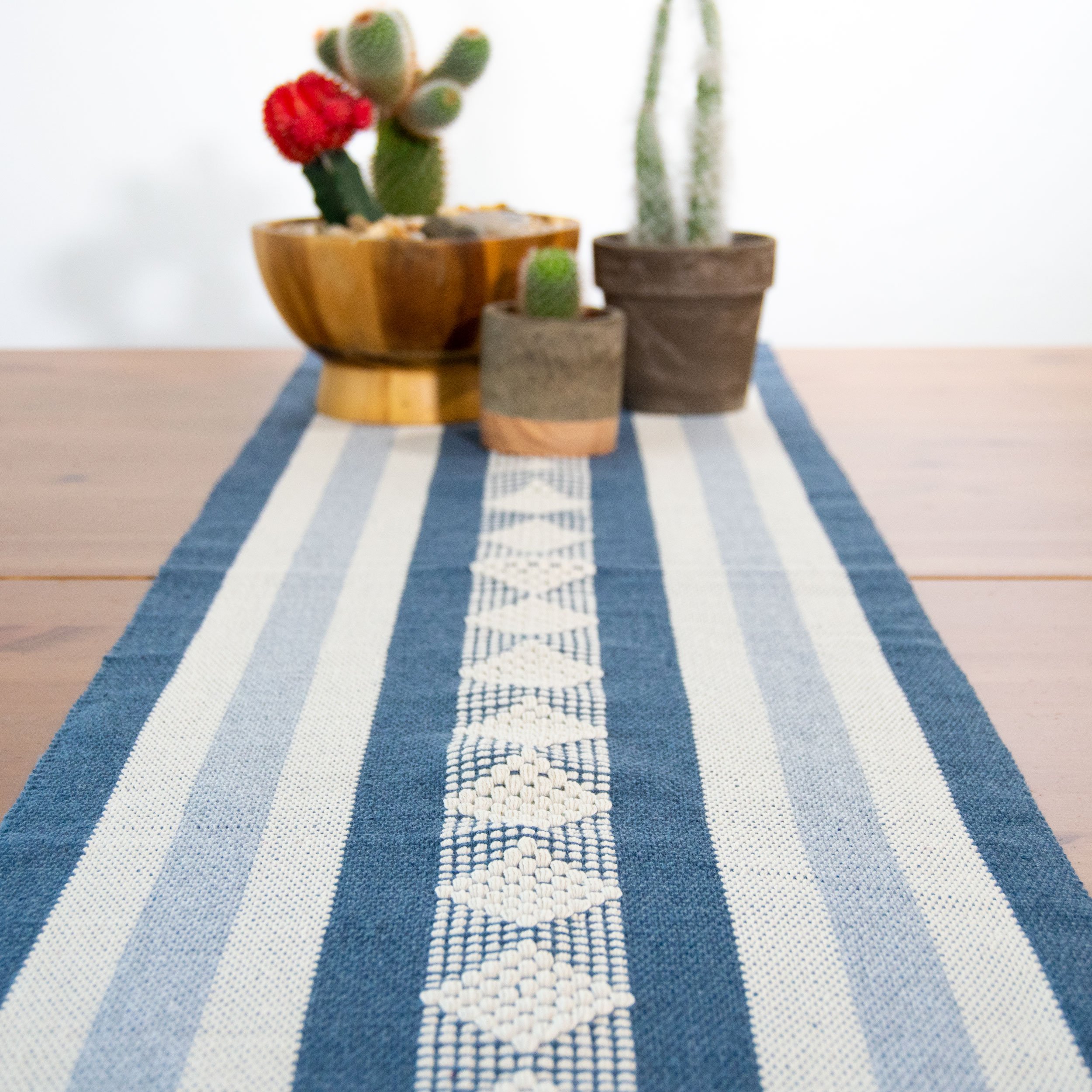 Jalieza Geometric Woven Table Runner featuring a diamond design in blue, handmade in Oaxaca, Mexico.