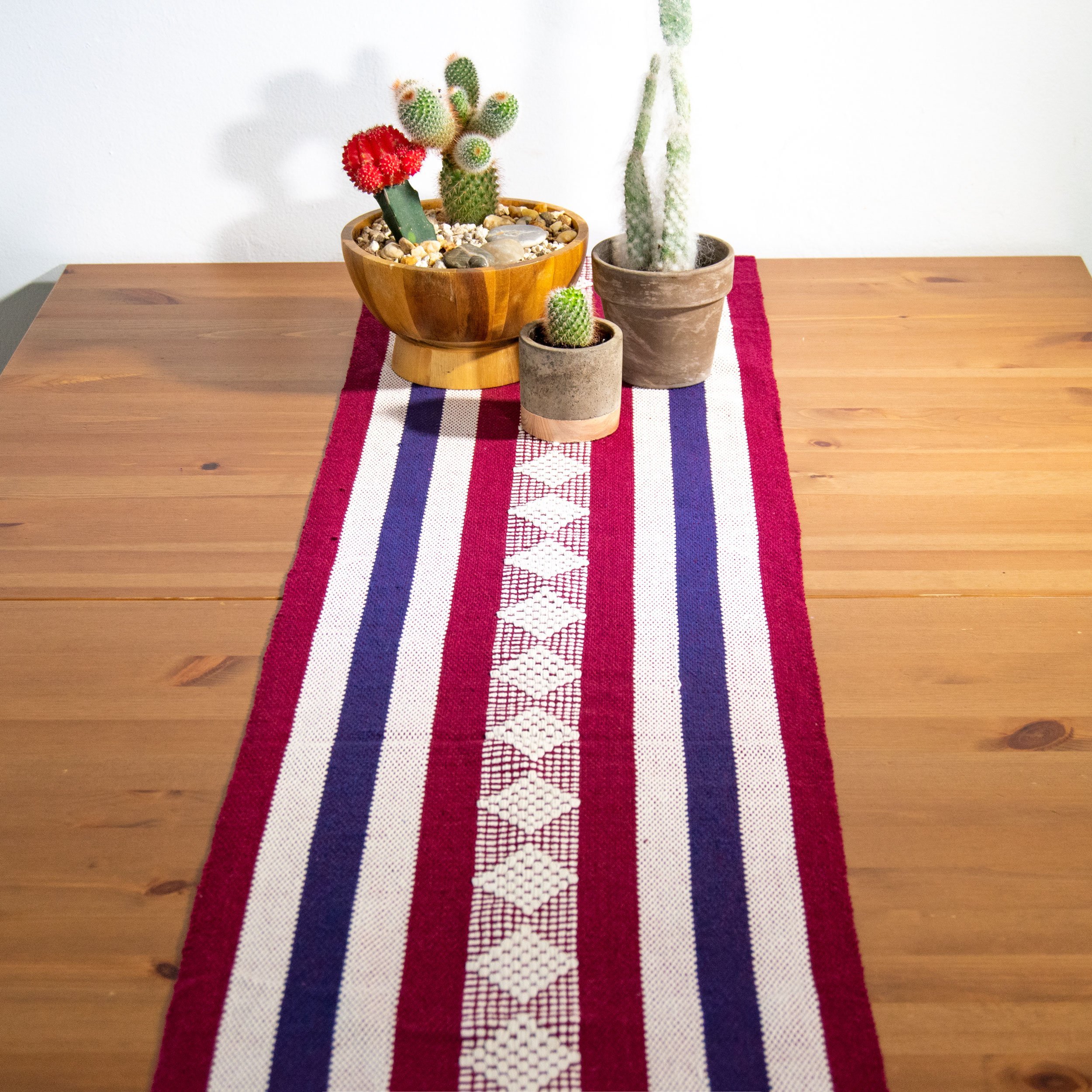 Jalieza Geometric Woven Table Runner featuring a diamond design in blue, handmade in Oaxaca, Mexico.