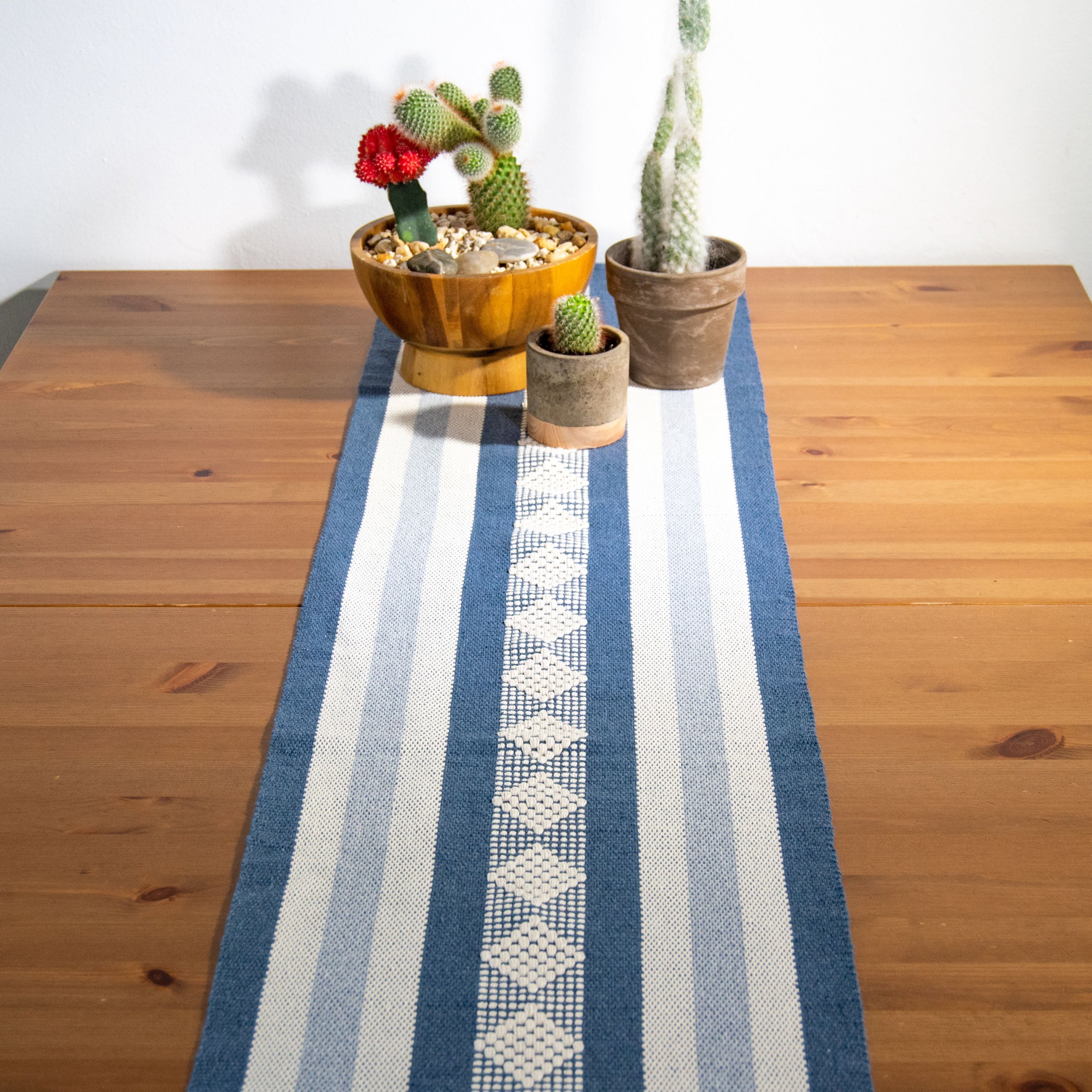 Jalieza Geometric Woven Table Runner featuring a diamond design in blue, handmade in Oaxaca, Mexico.