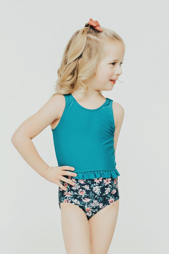 Janela Bay Dark Teal Little Ruffle Swim Top featuring a stylish ruffle detail and high neck design, perfect for beach outings.