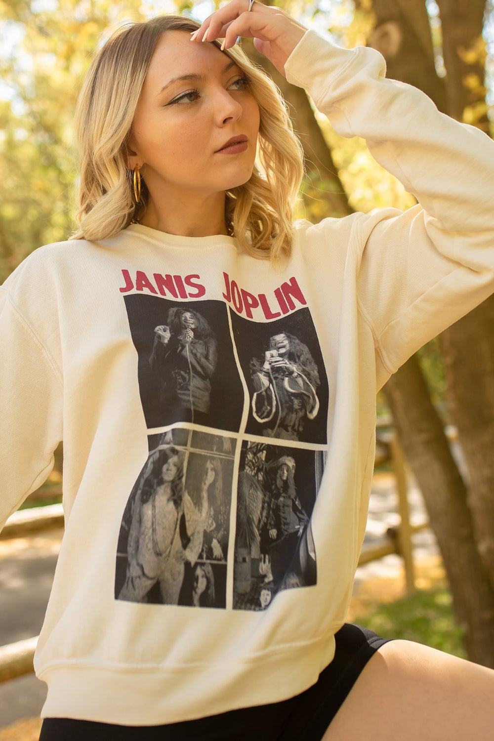 Ivory Janis Joplin sweatshirt featuring a graphic of the iconic singer, with raglan cuffed sleeves and a crew neck design.