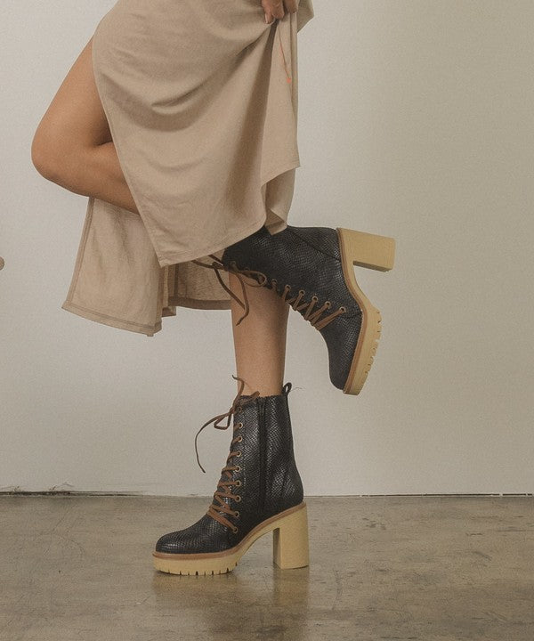 Jenna Platform Military Boots in black and camel suede, featuring a lace-up design and rubber heel for comfort and style.