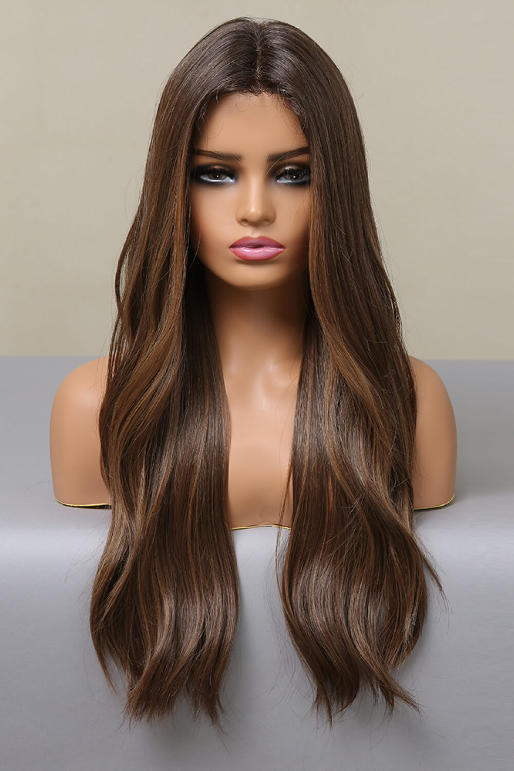 Jennifer Wig featuring long wavy synthetic hair with a lace front cap, displayed on a mannequin.