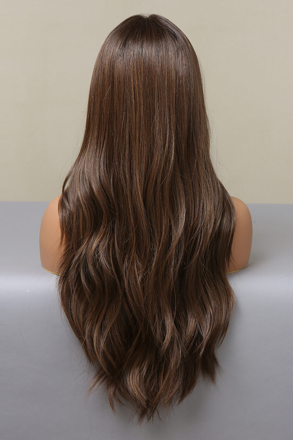 Jennifer Wig featuring long wavy synthetic hair with a lace front cap, displayed on a mannequin.