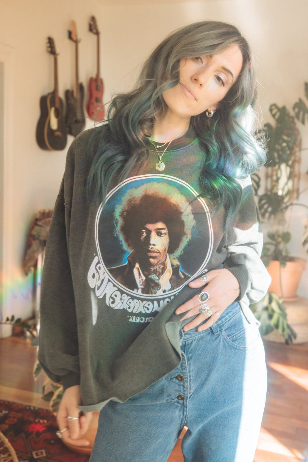 Jimi Hendrix Are You Experienced Sweatshirt in heathered black with cuffed sleeves and raw hem, featuring the iconic Jimi Hendrix logo.